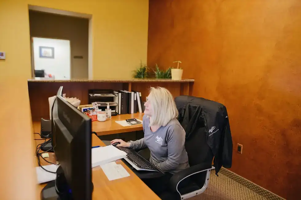 Apollo office staff member at the front desk